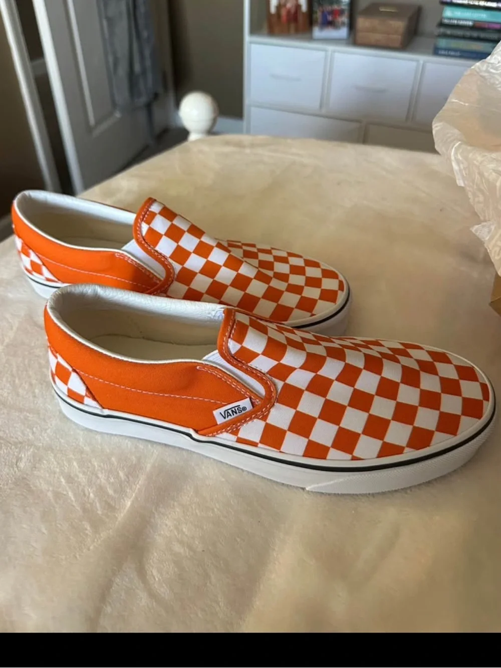 Orange and white checkerboard slip on vans